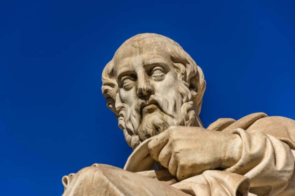 Pluto statue in blue sky background